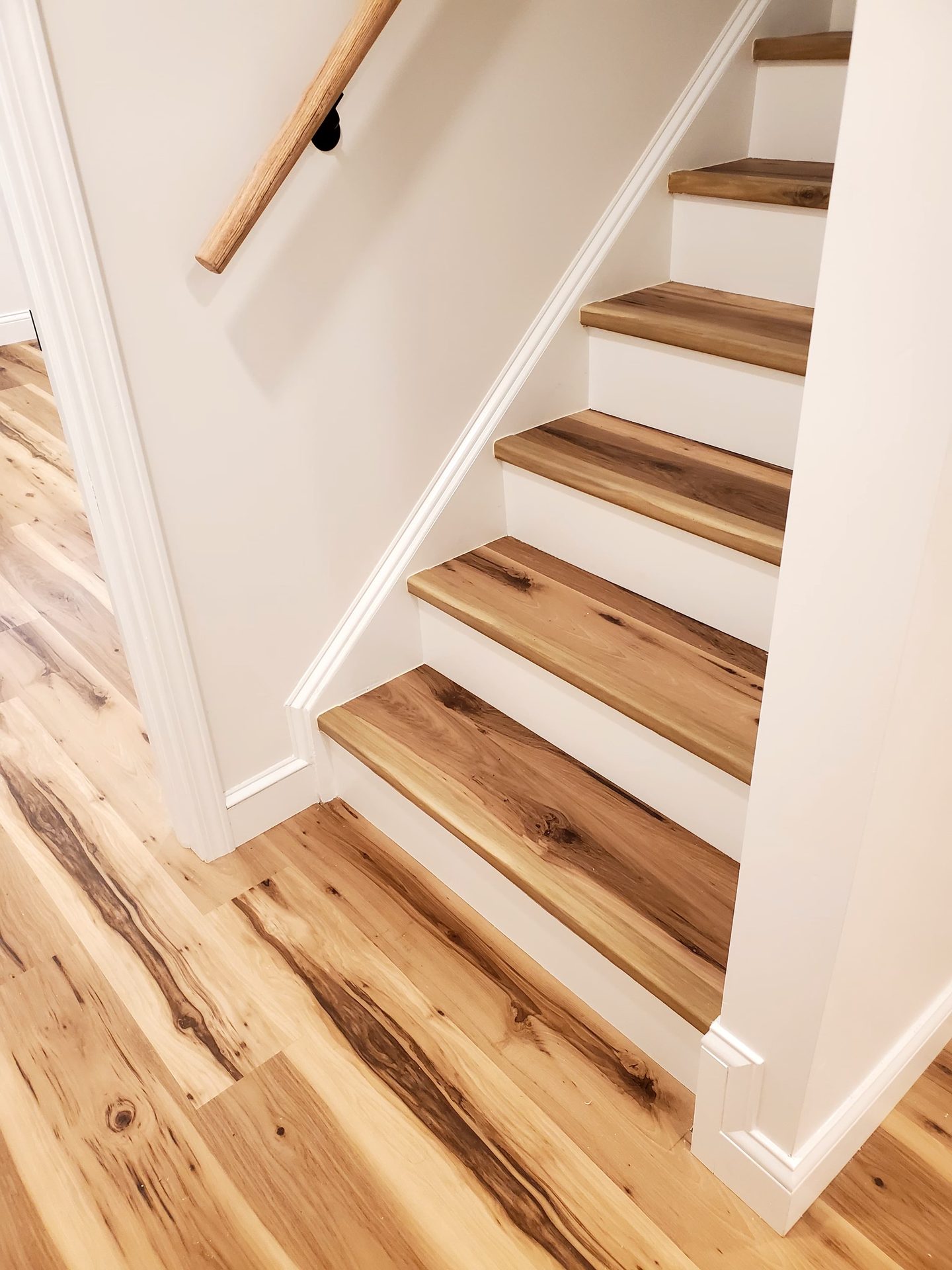 Finished hardwood staircase and hallway